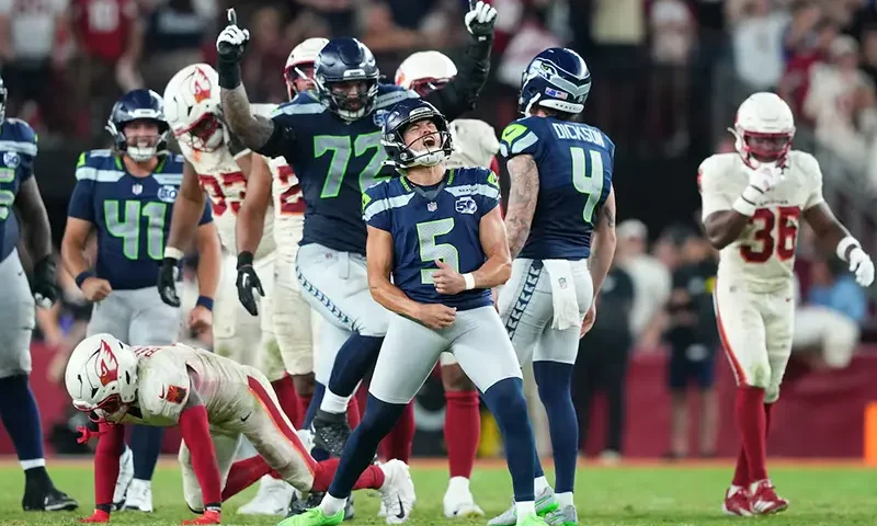 Seattle Seahawks place kicker Jason Myers (5) celebrates after kicking a game-winning field goal against the Arizona Cardinals at State Farm Stadium. Mandatory Credit: Joe Camporeale-Imagn Images