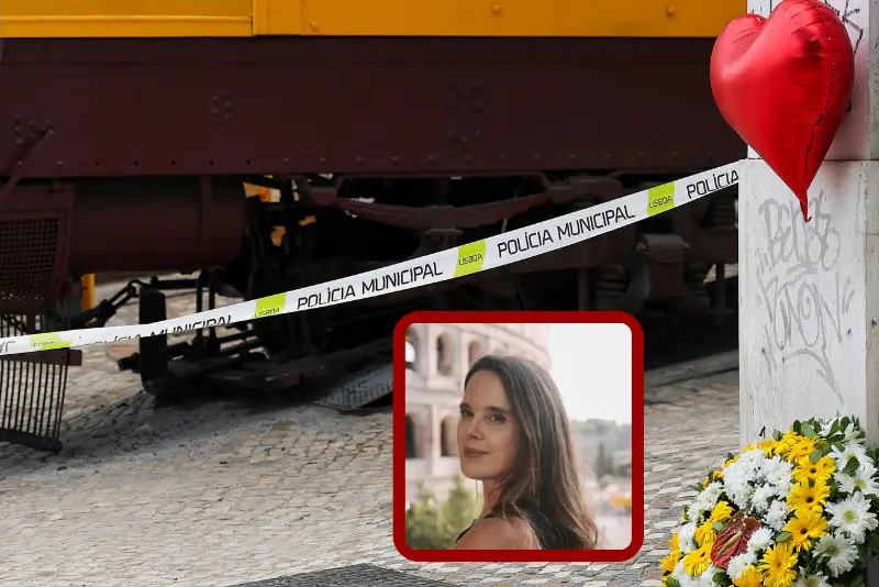 Flowers and a red-hearted balloon (R) in tribute to the victims are pictured the day after the Gloria funicular railway accident in Lisbon on September 4, 2025. Portugal held a day of national mourning on Thursday after one of Lisbon's famous funicular trains violently derailed and killed 16 people, including foreigners, and leaving five seriously injured. (Photo by PATRICIA DE MELO MOREIRA / AFP) (Photo by PATRICIA DE MELO MOREIRA/AFP via Getty Images)
