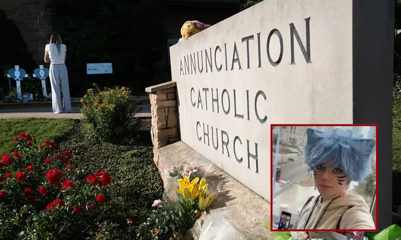 A memorial to yesterday's shooting victims sits in front of Annunciation Catholic Church on August 28, 2025 in Minneapolis, Minnesota. A gunman fired through the windows of the church while students were sitting in pews during a Catholic school Mass, killing two children and injuring at least 17 others. The gunman reportedly died at the scene from a self-inflicted gunshot wound, according to police. (Photo by Scott Olson/Getty Images)