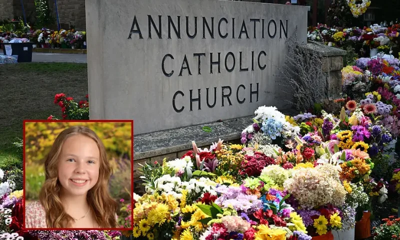 Flowers are seen outside the Annunciation Catholic Church in Minneapolis, Minnesota, on September 3, 2025, as the US vice president and second lady pay their respects at the site. On August 27 a shooter opened fire on school children attending a church service in Minneapolis, killing two pupils and wounding 17 people in the latest violent tragedy to jolt the United States. (Photo by Alex WROBLEWSKI / POOL / AFP) (Photo by ALEX WROBLEWSKI/POOL/AFP via Getty Images)