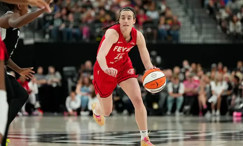 Indiana Fever guard Caitlin Clark (22) dribbles the ball during the second half of a WNBA basketball game against the Las Vegas Aces at T-Mobile Arena. Mandatory Credit: Lucas Peltier-Imagn Images/File Photo
