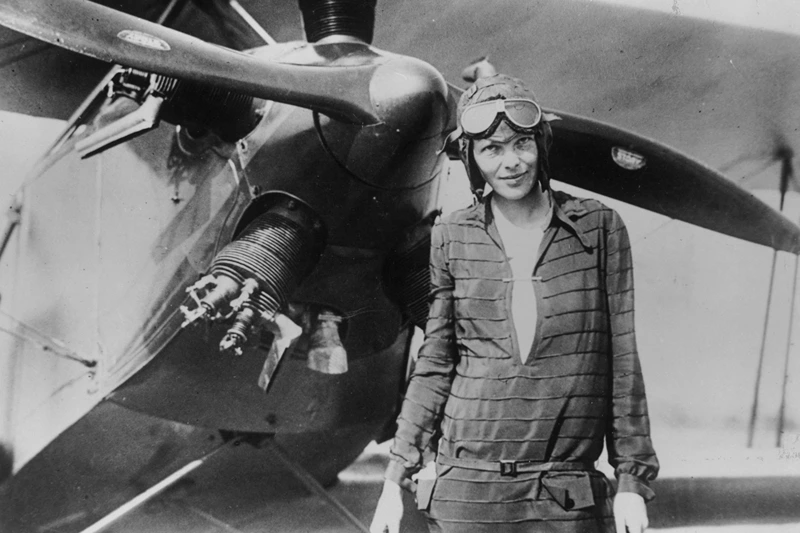 394033 03: (FILE PHOTO) Amelia Earhart stands June 14, 1928 in front of her bi-plane called "Friendship" in Newfoundland. Carlene Mendieta, who is trying to recreate Earhart's 1928 record as the first woman to fly across the US and back again, left Rye, NY on September 5, 2001. Earhart (1898 - 1937) disappeared without trace over the Pacific Ocean in her attempt to fly around the world in 1937. (Photo by Getty Images)