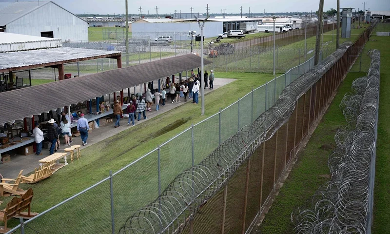 People view arts and crafts made by inmates and being sold by them during the Angola Prison Rodeo held at the Louisiana State Penitentiary April 23, 2023, in Angola, Louisiana. - The rode, which is in its 57th year, features inmates competing in rodeo events and selling crafts they make at the prison. (Photo by Brendan SMIALOWSKI / AFP) (Photo by BRENDAN SMIALOWSKI/AFP via Getty Images)