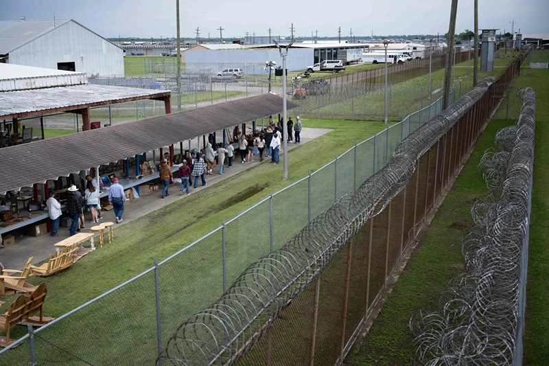 People view arts and crafts made by inmates and being sold by them during the Angola Prison Rodeo held at the Louisiana State Penitentiary April 23, 2023, in Angola, Louisiana. - The rode, which is in its 57th year, features inmates competing in rodeo events and selling crafts they make at the prison. (Photo by Brendan SMIALOWSKI / AFP) (Photo by BRENDAN SMIALOWSKI/AFP via Getty Images)