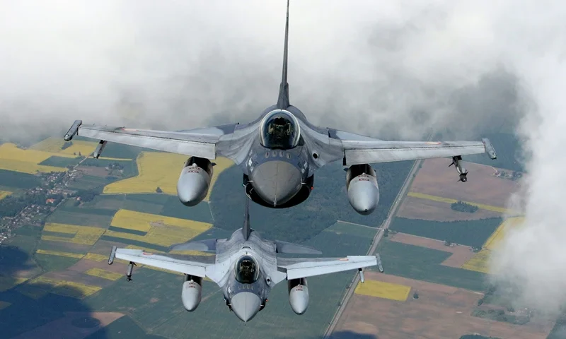 Romanian Air Force F-16s military fighter jets participate in NATO's Baltic Air Policing Mission in Lithuanian airspace near Siauliai, on May 23, 2023. (Photo by Petras Malukas / AFP) (Photo by PETRAS MALUKAS/AFP via Getty Images)