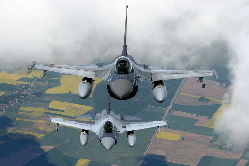 Romanian Air Force F-16s military fighter jets participate in NATO's Baltic Air Policing Mission in Lithuanian airspace near Siauliai, on May 23, 2023. (Photo by Petras Malukas / AFP) (Photo by PETRAS MALUKAS/AFP via Getty Images)