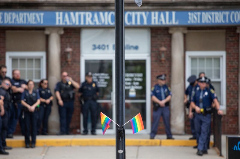 AMTRAMCK, MICHIGAN - JUNE 24: Hamtramck Police watch protesters who oppose the City of Hamtramck's recent resolution banning the flying of LGBTQ+ flags, political flags, and flags symbolizing any race or religion on City property, demonstrate at City Hall on June 24, 2023 in Hamtramck, Michigan. Last Tuesday's vote on the resolution by the Hamtramck City Council was unanimous 6-0, and has drawn criticism from some Michigan elected officials. (Photo by Bill Pugliano/Getty Images)