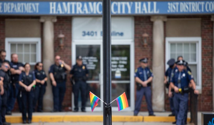 AMTRAMCK, MICHIGAN - JUNE 24: Hamtramck Police watch protesters who oppose the City of Hamtramck's recent resolution banning the flying of LGBTQ+ flags, political flags, and flags symbolizing any race or religion on City property, demonstrate at City Hall on June 24, 2023 in Hamtramck, Michigan. Last Tuesday's vote on the resolution by the Hamtramck City Council was unanimous 6-0, and has drawn criticism from some Michigan elected officials. (Photo by Bill Pugliano/Getty Images)