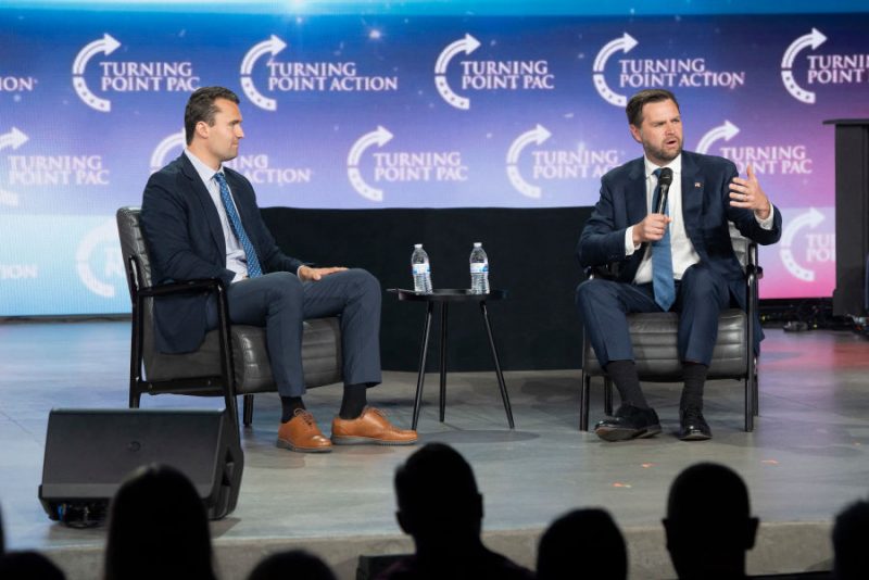Turning Point executive director Charlie Kirk (L) moderates a conversation with US Senator and Republican vice presidential candidate J.D. Vance during Turning Point Action's Chase the Vote campaign event at Generation Church in Mesa, Arizona, on September 4, 2024. (Photo by Rebecca NOBLE / AFP) (Photo by REBECCA NOBLE/AFP via Getty Images)