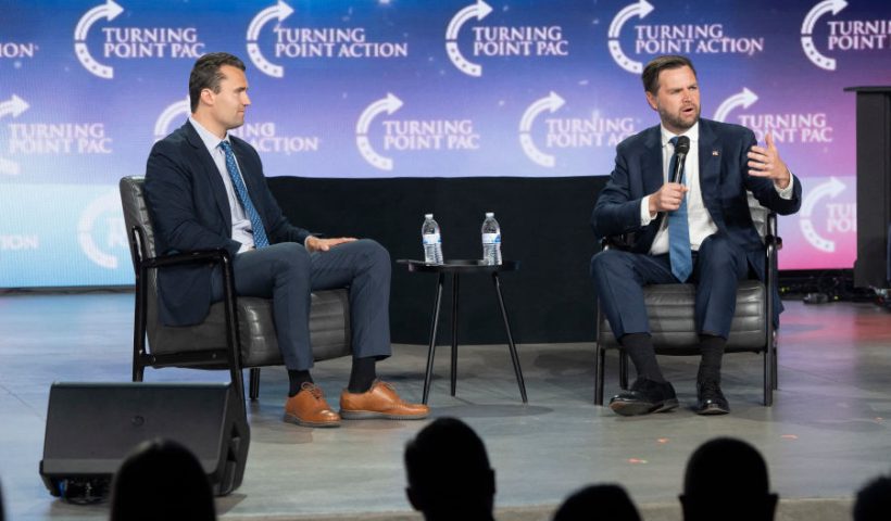 Turning Point executive director Charlie Kirk (L) moderates a conversation with US Senator and Republican vice presidential candidate J.D. Vance during Turning Point Action's Chase the Vote campaign event at Generation Church in Mesa, Arizona, on September 4, 2024. (Photo by Rebecca NOBLE / AFP) (Photo by REBECCA NOBLE/AFP via Getty Images)