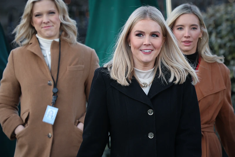 WASHINGTON, DC - JANUARY 22: White House Press Secretary Karoline Leavitt (C) walks toward members of the press outside the White House on January 22, 2025 in Washington, DC. Leavitt spoke briefly with members of the press following a short interview with Fox News. (Photo by Win McNamee/Getty Images)