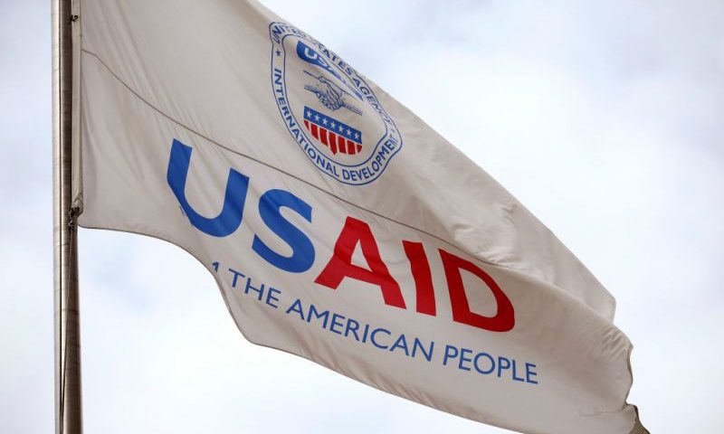 A flag outside of the U.S. Agency for International Development (USAID) headquarters is seen on February 03, 2025 in Washington, DC. Elon Musk, tech billionaire and head of the Department of Government Efficiency (DOGE), saaid in a social media post that he and U.S. President Doanld Trump will shut down foreign assistance agency. (Photo by Kevin Dietsch/Getty Images)