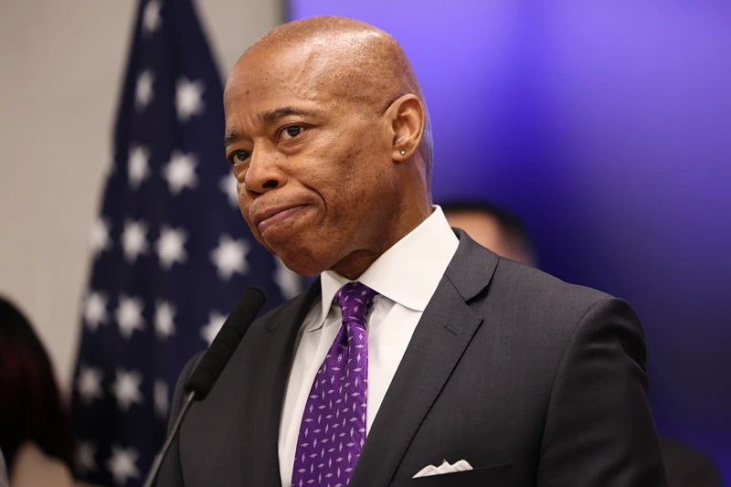 NEW YORK, NEW YORK - FEBRUARY 20: New York Mayor Eric Adams listens to questions from reporters during a press conference at NYPD's 40th Precinct on February 20, 2025 in New York City. A day after attending a court hearing in response to the Justice Department’s request to dismiss corruption charges against him, Adams was joined by local officials as they spoke on public safety and quality of life affecting community members in the Bronx. Earlier this week, four deputy mayors from Adams' administration resigned over his cooperation with U.S. President Donald Trump's immigration policies, which prosecutors on his bribery case alleged was part of a deal with the Trump administration's Department of Justice to drop charges against him. (Photo by Michael M. Santiago/Getty Images)