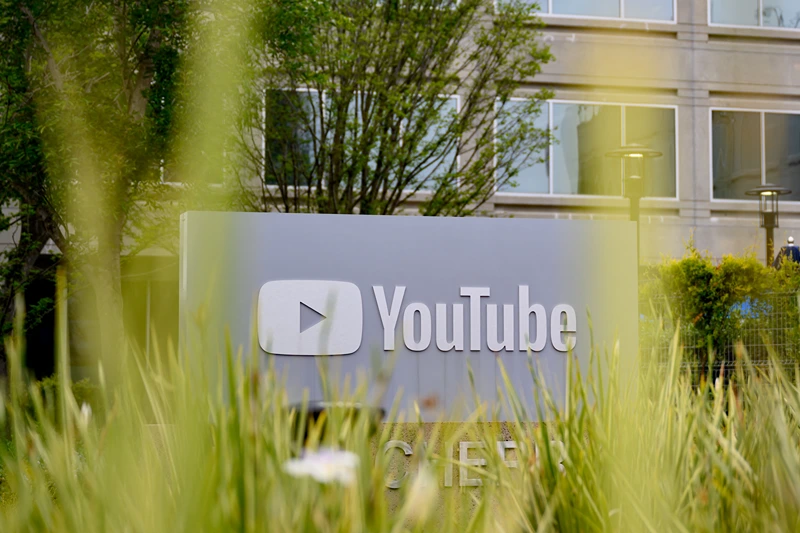 The YouTube logo is seen outside the company's corporate headquarters in San Bruno, California, on April 23, 2025. YouTube turned 20 years old and is on track to become the biggest media company by revenue at $550 billion. (Photo by JOSH EDELSON / AFP) (Photo by JOSH EDELSON/AFP via Getty Images)