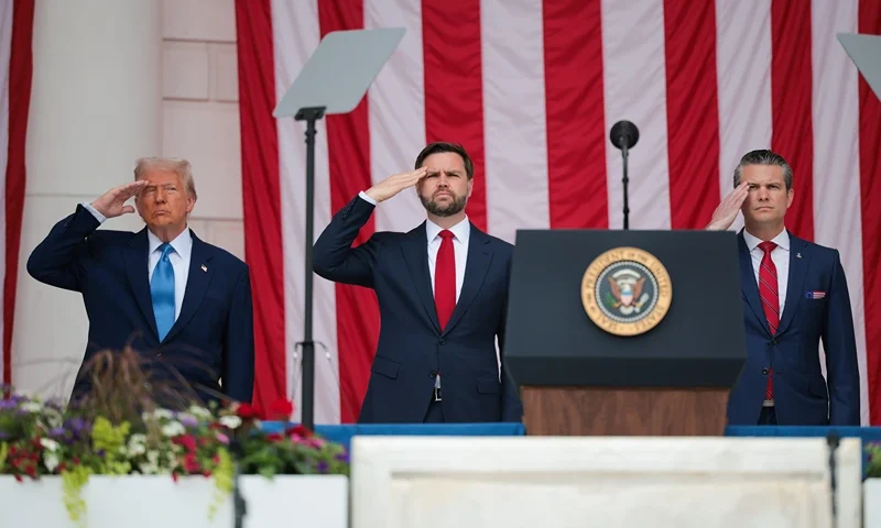 ARLINGTON, VIRGINIA - MAY 26: (L-R) U.S. President Donald Trump, U.S. Vice President JD Vance, and U.S. Secretary of Defense Pete Hegseth greet visitors during the Memorial Day wreath-laying ceremony at the Memorial Amphitheater in Arlington National Cemetery on May 26, 2025 in Arlington, Virginia. Memorial Day is observed on the last Monday in May each year to honor and mourn U.S. military personnel who died while serving in the United States Armed Forces. (Photo by Kayla Bartkowski/Getty Images)