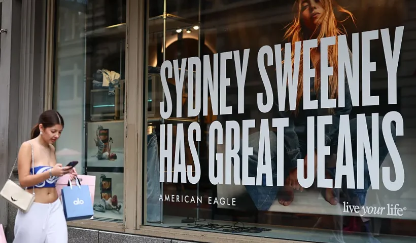 NEW YORK, NEW YORK - AUGUST 01: A window display of actress Sydney Sweeney is seen on a window of an American Eagle store on August 01, 2025 in New York City. American Eagle’s recent denim ad campaign featuring Sweeney has drawn backlash for language and imagery that critics say echoes eugenics-era rhetoric, following a tagline referencing “great genes” alongside visuals of Sweeney in blue jeans. (Photo by Michael M. Santiago/Getty Images)