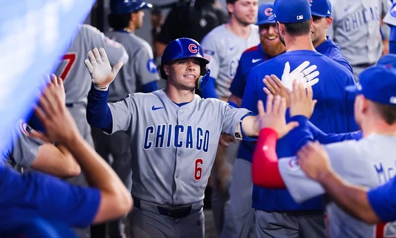 TORONTO, CANADA - AUGUST 13: Matt Shaw #6 of the Chicago Cubs celebrates in the dugout after hitting a solo-home run in the fifth inning of their MLB game against the Toronto Blue Jays at Rogers Centre on August 13, 2025 in Toronto, Ontario, Canada. (Photo by Cole Burston/Getty Images)