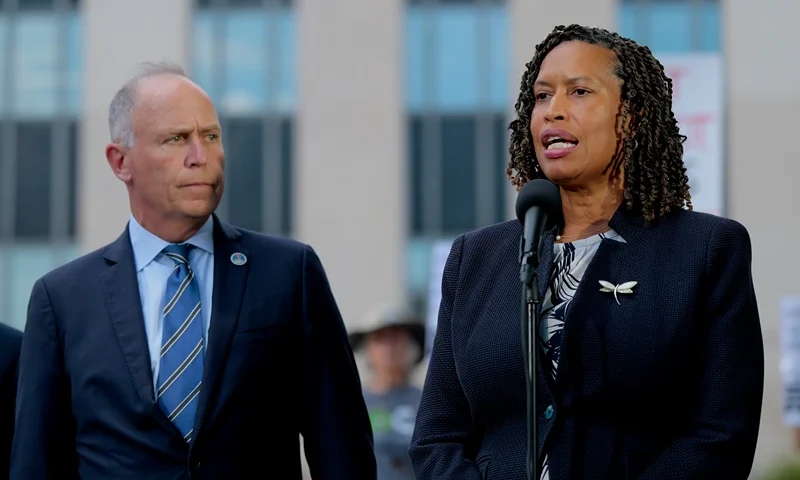 WASHINGTON, DC - AUGUST 15: Washington, DC Attorney General Brian Schwalb and Mayor Murial Bowser speak outside of the E. Barrett Prettyman U.S. Court House following a court hearing on August 15, 2025 in Washington, DC. Schwalb filed a lawsuit against the federal government claiming that the Trump Administration overstepped its authority when the federal government took over the Metropolitan Police Department and replaced the chief of police with a federal official. (Photo by Anna Moneymaker/Getty Images)