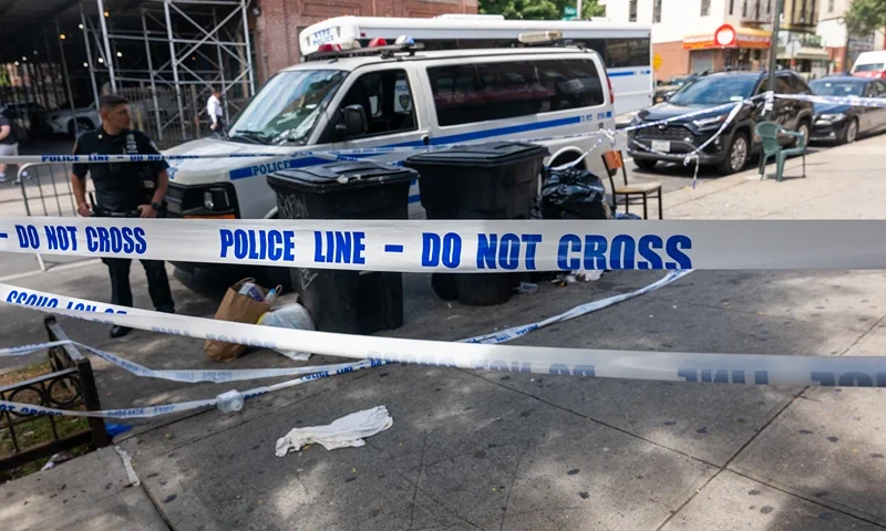 NEW YORK, NEW YORK - AUGUST 19: Police patrol near a hookah lounge where three people were shot dead and 10 others wounded following a shooting at the Taste of the City lounge in Crown Heights, Brooklyn, early Sunday on August 19, 2025, in New York City. Police, anti-violence activists, and others have been making a strong presence in the neighborhood, which has experienced a number of shootings over the years. Police believe that the violence was gang-related and are still searching for two suspects in the shooting. (Photo by Spencer Platt/Getty Images)