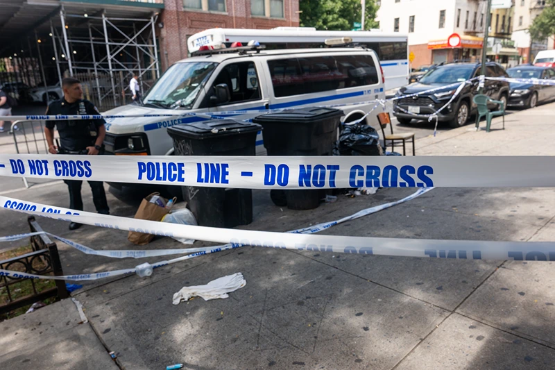 NEW YORK, NEW YORK - AUGUST 19: Police patrol near a hookah lounge where three people were shot dead and 10 others wounded following a shooting at the Taste of the City lounge in Crown Heights, Brooklyn, early Sunday on August 19, 2025, in New York City. Police, anti-violence activists, and others have been making a strong presence in the neighborhood, which has experienced a number of shootings over the years. Police believe that the violence was gang-related and are still searching for two suspects in the shooting. (Photo by Spencer Platt/Getty Images)
