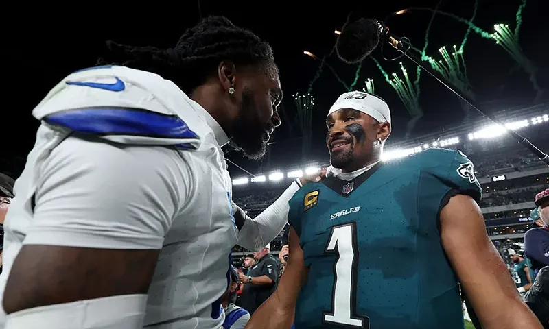 Trevon Diggs #7 of the Dallas Cowboys congratulates Jalen Hurts #1 of the Philadelphia Eagles after the game at Lincoln Financial Field on September 04, 2025 in Philadelphia, Pennsylvania. (Photo by Emilee Chinn/Getty Images)