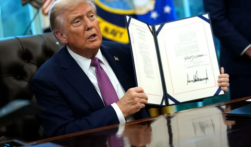 WASHINGTON, DC - SEPTEMBER 05: U.S. President Donald Trump holds up the Homebuyers Privacy Protection Act after signing it into law, during a press availability in the Oval Office of the White House on September 05, 2025 in Washington, DC. President Trump signed a series of executive orders which included the renaming of the Department of Defense to the Department of War. (Photo by Kevin Dietsch/Getty Images)