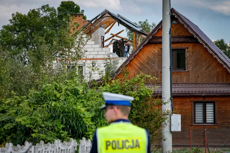 Police and army inspect damage to a house destroyed by debris from a shot down Russian drone in the village of Wyryki-Wola, eastern Poland, on September 10, 2025. NATO air defences helped counter drones that entered Polish airspace overnight and alliance chief Mark Rutte is in contact with Warsaw, a NATO spokeswoman said Wednesday. Polish Prime Minister Donald Tusk said Wednesday that a violation of Polish airspace by several Russian drones overnight was a major provocation aimed at the EU and NATO member. (Photo by Wojtek RADWANSKI / AFP) (Photo by WOJTEK RADWANSKI/AFP via Getty Images)