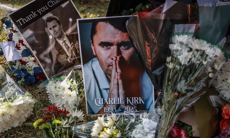 TOPSHOT - A general view of a wreath laid by mourners outside the US Embassy in Pretoria on September 11, 2025 following the fatal shooting of US youth activist and influencer Charlie Kirk while speaking during an event at Utah Valley University in Orem, Utah, United States. US youth activist and influencer Charlie Kirk, a major ally of President Donald Trump, was shot on September 10, 2025 at a US university. Kirk was speaking at an event at Utah Valley University when the attack happened. (Photo by Phill Magakoe / AFP) (Photo by PHILL MAGAKOE/AFP via Getty Images)