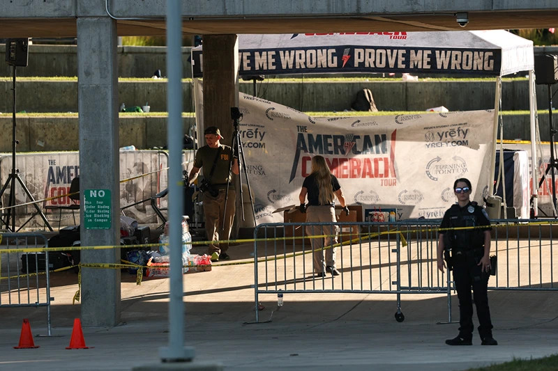Law enforcement officials work near the crime scene where political activist Charlie Kirk was shot and killed at Utah Valley University in Orem, Utah, on September 11, 2025. The gunman who shot dead US right-wing youth leader Charlie Kirk in a targeted killing remained at large Thursday but authorities said they have video images of the suspect and have recovered a "high-powered" rifle. Kirk, a 31-year-old superstar on the Republican right who was credited with helping Donald Trump return to the presidency last year, was shot while addressing a large crowd at Utah Valley University on Wednesday. (Photo by Patrick T. Fallon / AFP) (Photo by PATRICK T. FALLON/AFP via Getty Images)