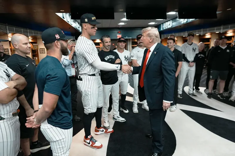 NEW YORK, NY - SEPTEMBER 11: U.S. President Donald Trump shakes hands with Aaron Judge of the New York Yankees in the locker room before a game against the Detroit Tigers at Yankee Stadium on September 11, 2025 in New York City. (Photo by Doug Mills-Pool/Getty Images)