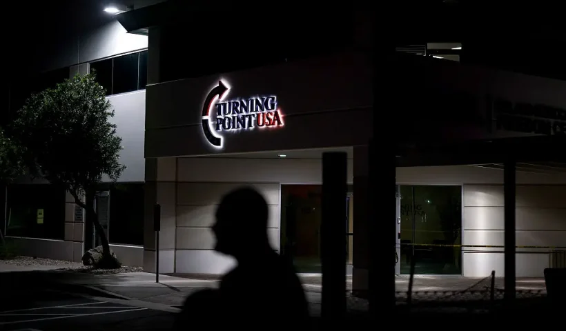 PHOENIX, ARIZONA - SEPTEMBER 11: A man stands near a memorial for Charlie Kirk at the Turning Point USA headquarters on September 11, 2025 in Phoenix, Arizona. Kirk the CEO and co-founder of Turning Point USA was shot and killed on Wednesday in Utah. on September 11, 2025 in Phoenix, Arizona. (Photo by Eric Thayer/Getty Images)