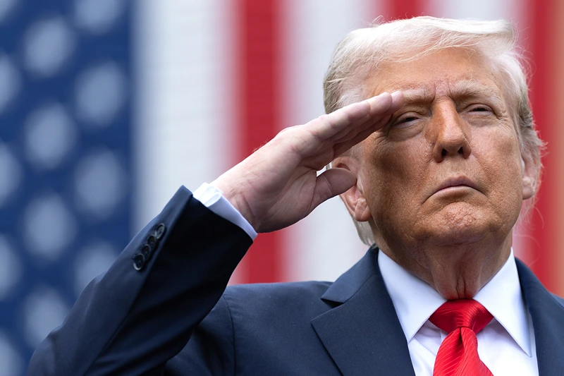 ARLINGTON, VIRGINIA - SEPTEMBER 11: U.S. President Donald Trump salutes during the playing of "Taps" at a September 11th observance event in the courtyard of the Pentagon September 11, 2025 in Arlington, Virginia. Today marks the 24th anniversary of the 9/11 terror attacks that claimed the lives of nearly 3,000 people. (Photo by Win McNamee/Getty Images)