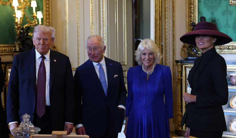 WINDSOR, ENGLAND - SEPTEMBER 17: US President Donald Trump, King Charles III, Queen Camilla and First Lady Melania Trump view items on display during a visit to the Royal Collection exhibition, in the Green Drawing Room during the State visit by the President of the United States of America at Windsor Castle on September 17, 2025 in Windsor, England. President Trump is in England from Sept. 16-18 on his second UK state visit, with the previous one taking place in 2019 during his first presidential term. (Photo by Anna Moneymaker/Getty Images)