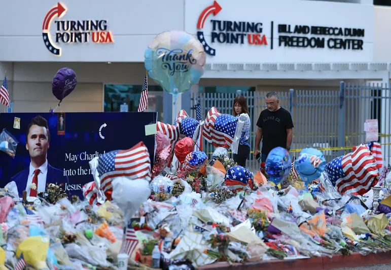 PHOENIX, ARIZONA - SEPTEMBER 18: People visit the makeshift memorial for Charlie Kirk outside the headquarters of Turning Point USA on September 18, 2025, in Phoenix, Arizona. Kirk, the CEO and co-founder of Turning Point USA, was shot and killed on September 10th while speaking at an event for his "American Comeback Tour" at Utah Valley University. (Photo by Joe Raedle/Getty Images)