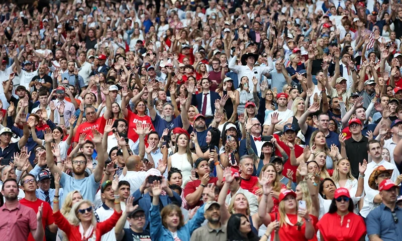 GLENDALE, ARIZONA - SEPTEMBER 21: Attendees wait for the start of the memorial service for political activist Charlie Kirk at State Farm Stadium on September 21, 2025 in Glendale, Arizona. Kirk, the CEO and co-founder of Turning Point USA, was shot and killed on September 10th while speaking at an event during his "American Comeback Tour" at Utah Valley University. (Photo by Eric Thayer/Getty Images)