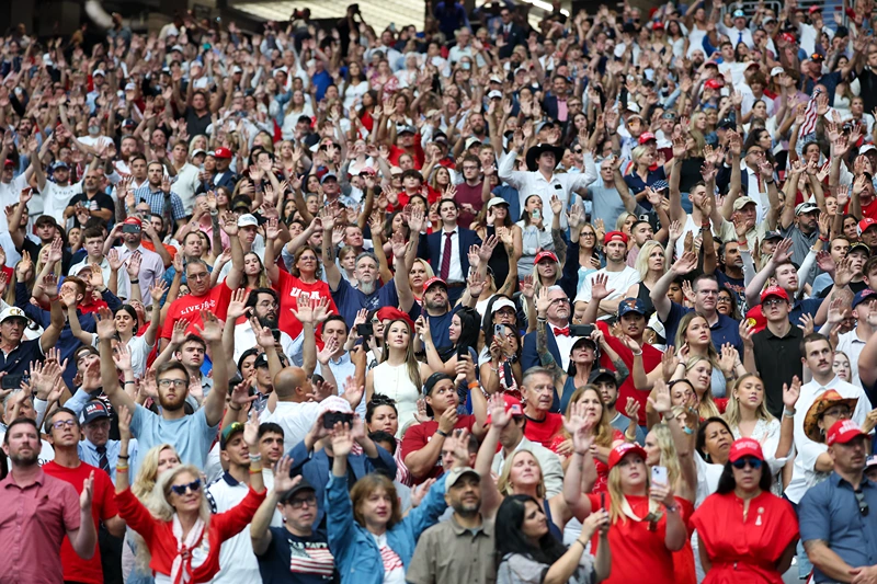 GLENDALE, ARIZONA - SEPTEMBER 21: Attendees wait for the start of the memorial service for political activist Charlie Kirk at State Farm Stadium on September 21, 2025 in Glendale, Arizona. Kirk, the CEO and co-founder of Turning Point USA, was shot and killed on September 10th while speaking at an event during his "American Comeback Tour" at Utah Valley University. (Photo by Eric Thayer/Getty Images)