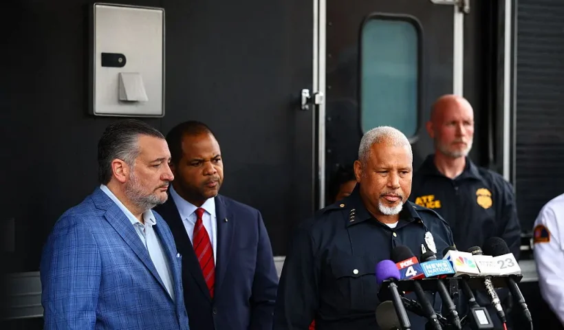 (L-R) US Senator Ted Cruz, Republican from Texas, Mayor of Dallas Eric Johnson and Dallas Chief of Police Daniel Comeaux speak during a press conference following a shooting at a US Immigration and Customs Enforcement (ICE) detention facility in Dallas, Texas, on September 24, 2025. One person was killed and two wounded in a shooting on Wednesday at a US Immigration and Customs Enforcement (ICE) detention facility in the US city of Dallas, officials said. (Photo by Aric Becker / AFP) (Photo by ARIC BECKER/AFP via Getty Images)