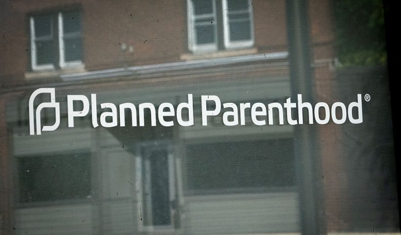 KENOSHA, WISCONSIN - SEPTEMBER 25: A sign is attached to the front door of a Planned Parenthood clinic on September 25, 2025 in Kenosha, Wisconsin. Planned Parenthood of Wisconsin will reportedly pause scheduling abortion appointments starting Oct. 1, due to fears of losing Medicaid funding because of a provision in the Trump administration's federal funding bill which bars clinics that provide abortions from accepting Medicaid funds for any of their other reproductive services. (Photo by Scott Olson/Getty Images)