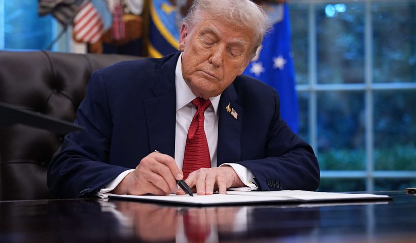 WASHINGTON, DC - SEPTEMBER 25: U.S. President Donald Trump holds signs an executive order in the Oval Office of the White House on September 25, 2025 in Washington, DC. Trump signed proclamations and an executive order, including approving a partial sale of TikTok’s U.S. operations, following a 2024 law requiring parent company ByteDance to divest or face a ban. (Photo by Andrew Harnik/Getty Images)