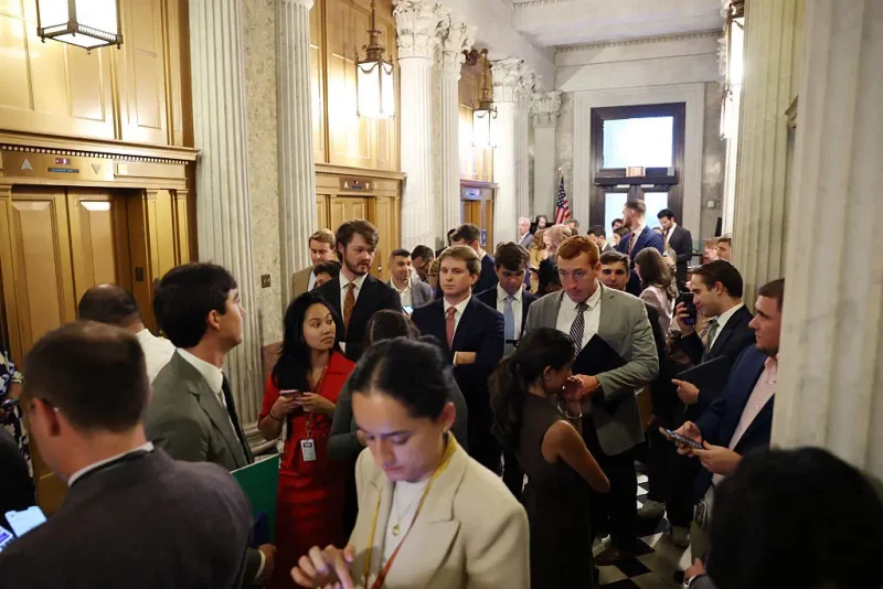 WASHINGTON, DC - SEPTEMBER 30: Reporters and staff members wait for Senators outside of the Senate Chambers in the U.S. Capitol Building on September 30, 2025 in Washington, DC. The Senate is bracing for a government shutdown after they failed to pass the Republican Appropriations and Extensions Act which would provide a temporary extension on government funding. Three Democrats joined Republicans in their vote for the legislation. (Photo by Anna Moneymaker/Getty Images)