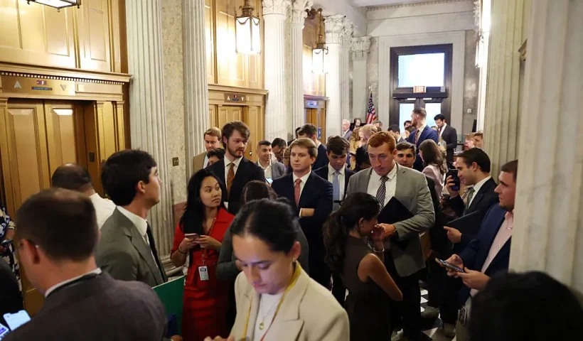 WASHINGTON, DC - SEPTEMBER 30: Reporters and staff members wait for Senators outside of the Senate Chambers in the U.S. Capitol Building on September 30, 2025 in Washington, DC. The Senate is bracing for a government shutdown after they failed to pass the Republican Appropriations and Extensions Act which would provide a temporary extension on government funding. Three Democrats joined Republicans in their vote for the legislation. (Photo by Anna Moneymaker/Getty Images)