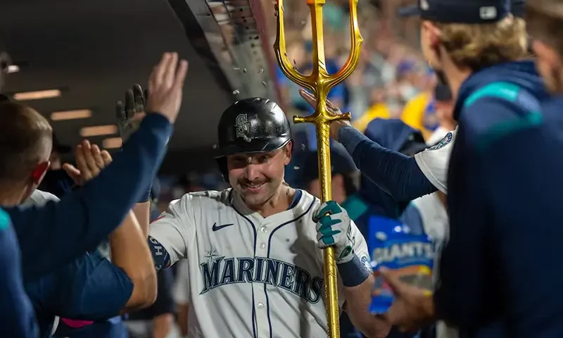 Seattle Mariners catcher Cal Raleigh (29) celebrates in the dugout after hitting a solo home run during the eighth inning against the Colorado Rockies at T-Mobile Park. Mandatory Credit: Stephen Brashear-Imagn Images
