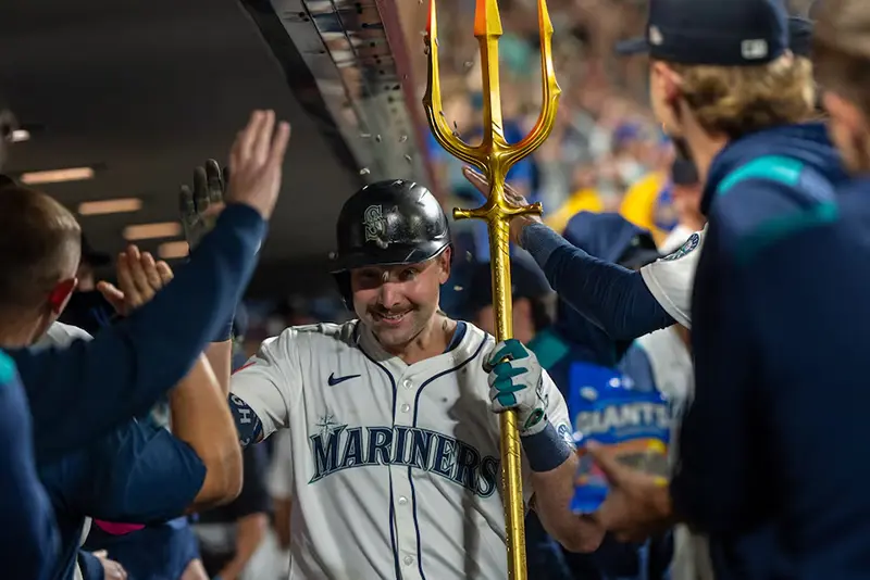 Seattle Mariners catcher Cal Raleigh (29) celebrates in the dugout after hitting a solo home run during the eighth inning against the Colorado Rockies at T-Mobile Park. Mandatory Credit: Stephen Brashear-Imagn Images