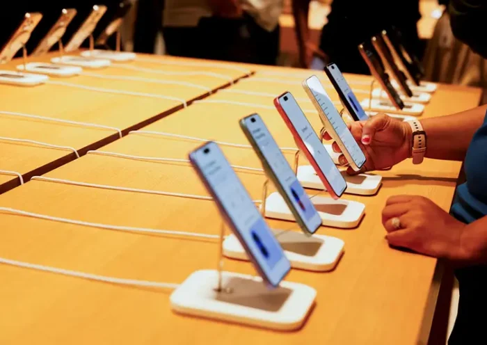 A person holds an Apple iPhone at the company's first retail store in Bengaluru, India, September 2, 2025. REUTERS/Priyanshu Singh/File Photo