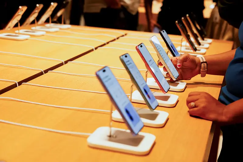 A person holds an Apple iPhone at the company's first retail store in Bengaluru, India, September 2, 2025. REUTERS/Priyanshu Singh/File Photo