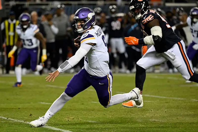 Minnesota Vikings quarterback J.J. McCarthy (9) rushes the ball against the Chicago Bears during the first half at Soldier Field. Mandatory Credit: Matt Marton-Imagn Images