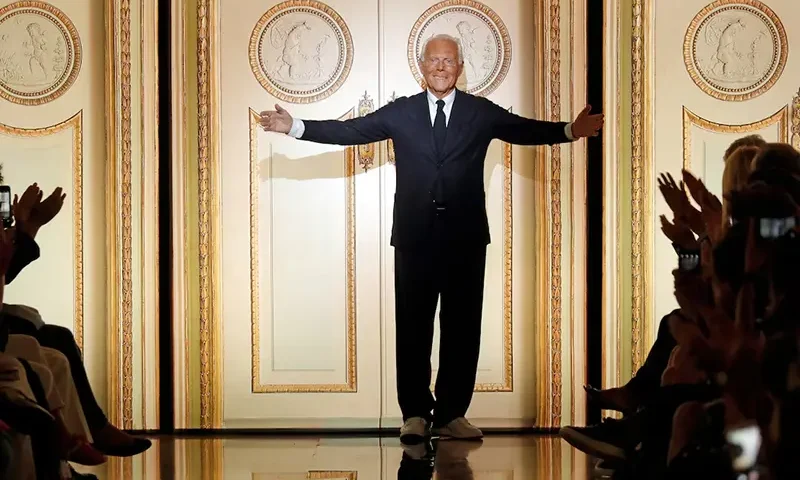 Italian designer Giorgio Armani acknowledges the applause at the end of his Haute Couture Fall/Winter 2017/2018 collection show in Paris, France, July 4, 2017. REUTERS/Charles Platiau/File Photo
