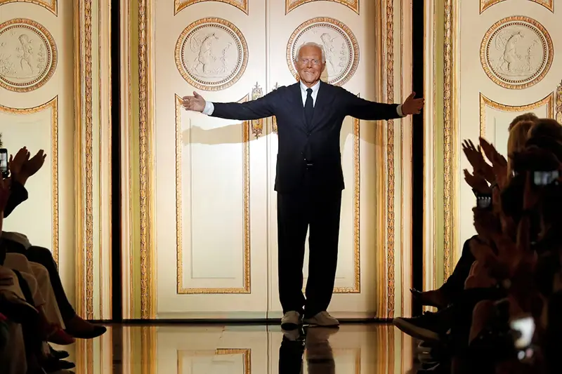 Italian designer Giorgio Armani acknowledges the applause at the end of his Haute Couture Fall/Winter 2017/2018 collection show in Paris, France, July 4, 2017. REUTERS/Charles Platiau/File Photo