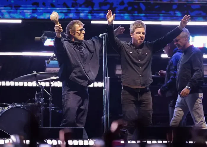 Liam Gallagher and Noel Gallagher from the British rock band Oasis, react during their Oasis Live '25 Tour at the Rose Bowl Stadium in Pasadena, California, U.S., September 6, 2025. REUTERS/Mario Anzuoni/File Photo