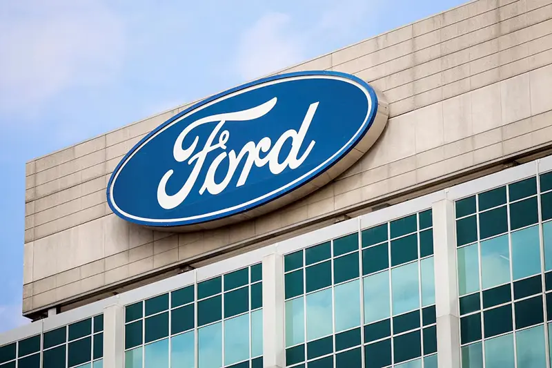 A Ford logo is seen on the Ford Motor World headquarters in Dearborn, Michigan, U.S., March 12, 2025. REUTERS/Rebecca Cook/File Photo